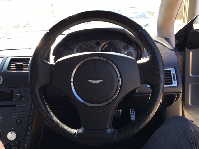close up of silver Aston Martin V8 Vantage (2006) steering wheel at topcats racing workshop